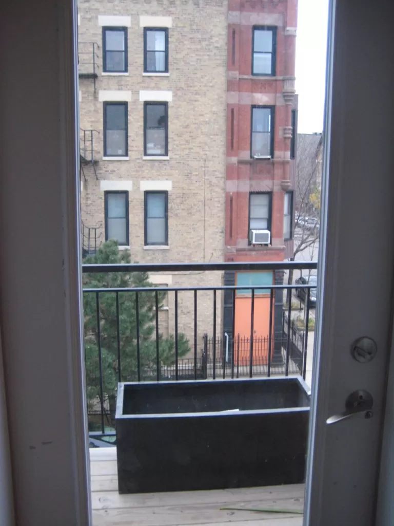 Containers in various shapes and materials on a balcony