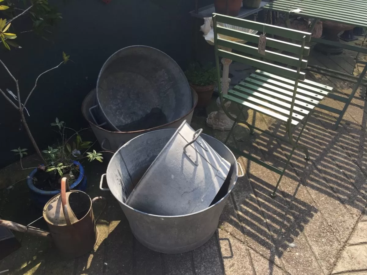 Antique metal washtub container chosen for a mini patio pond