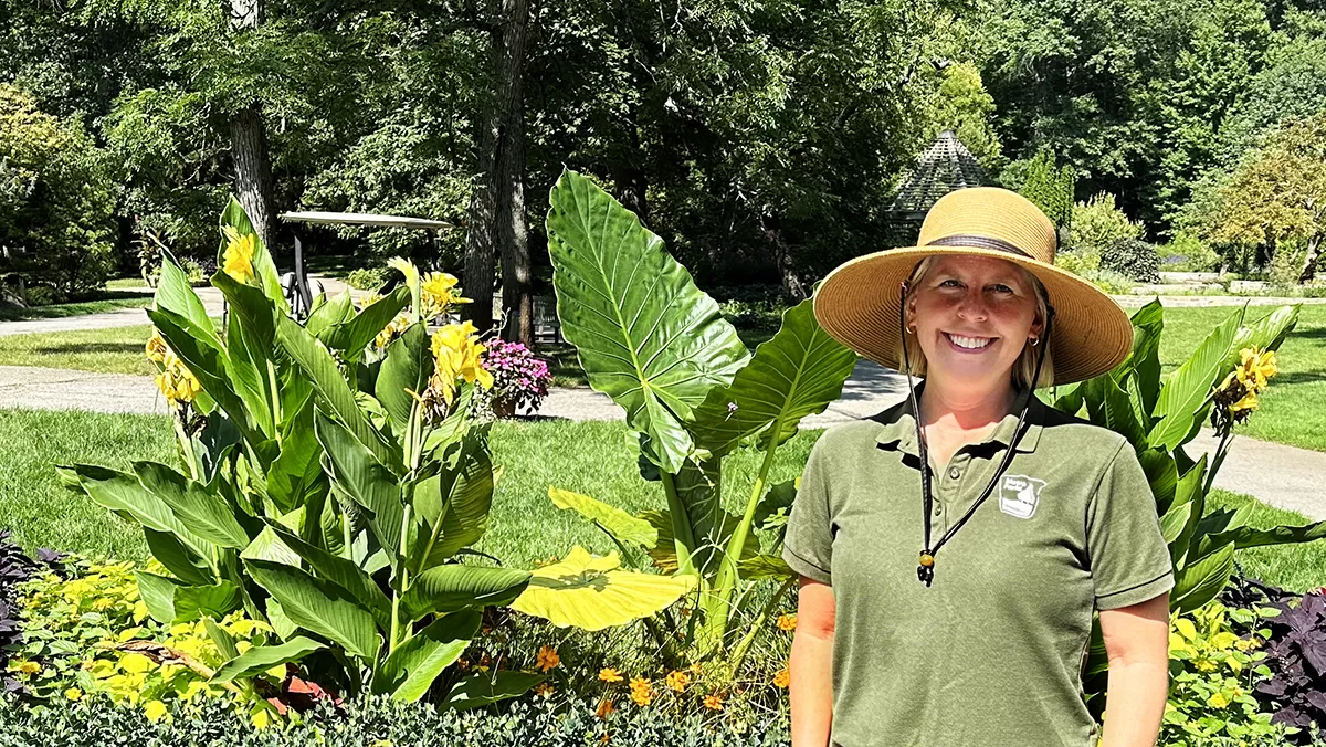 Horticulturist discussing vibrant plants for seasonal thematic container displays